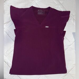 Like new FIGS scrubs. The color is a plum-like shade.